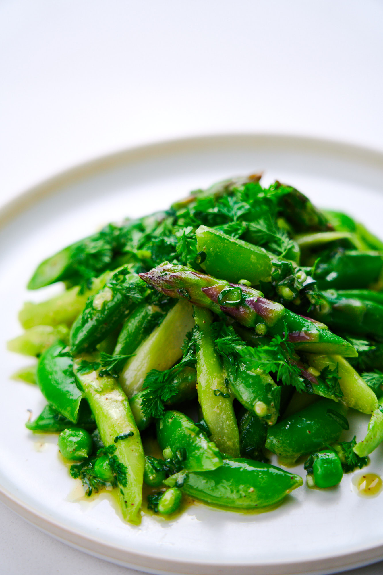 Delicious asparagus and snap pea salad with a sweet and tangy mustard vinaigrette.