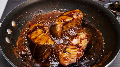 Black cod cooking in a rich sauce for Soy Sauce Braised Black Cod (Gindara Nitsuke)