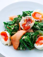 Broccolini with Smoked Salmon and Eggs on a plate.