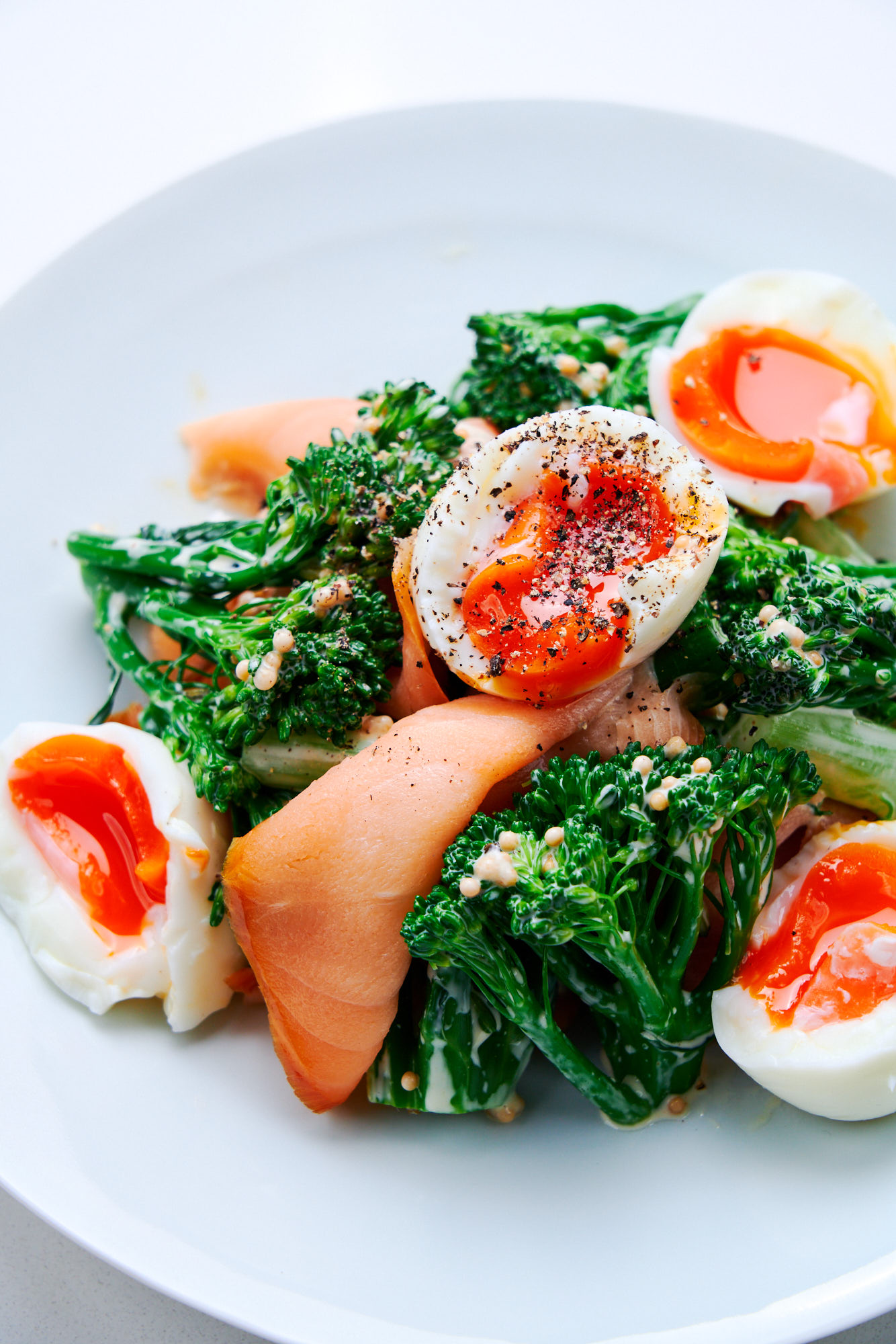 Broccolini with Smoked Salmon and Eggs on a plate.