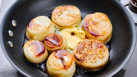 Adding the butter to White Eggplant Steak with Butter Soy Sauce