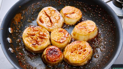 White Eggplant Steak with Butter Soy Sauce in a pan.