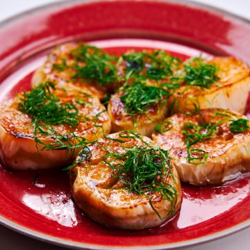 White Eggplant Steak with Butter Soy Sauce on a plate