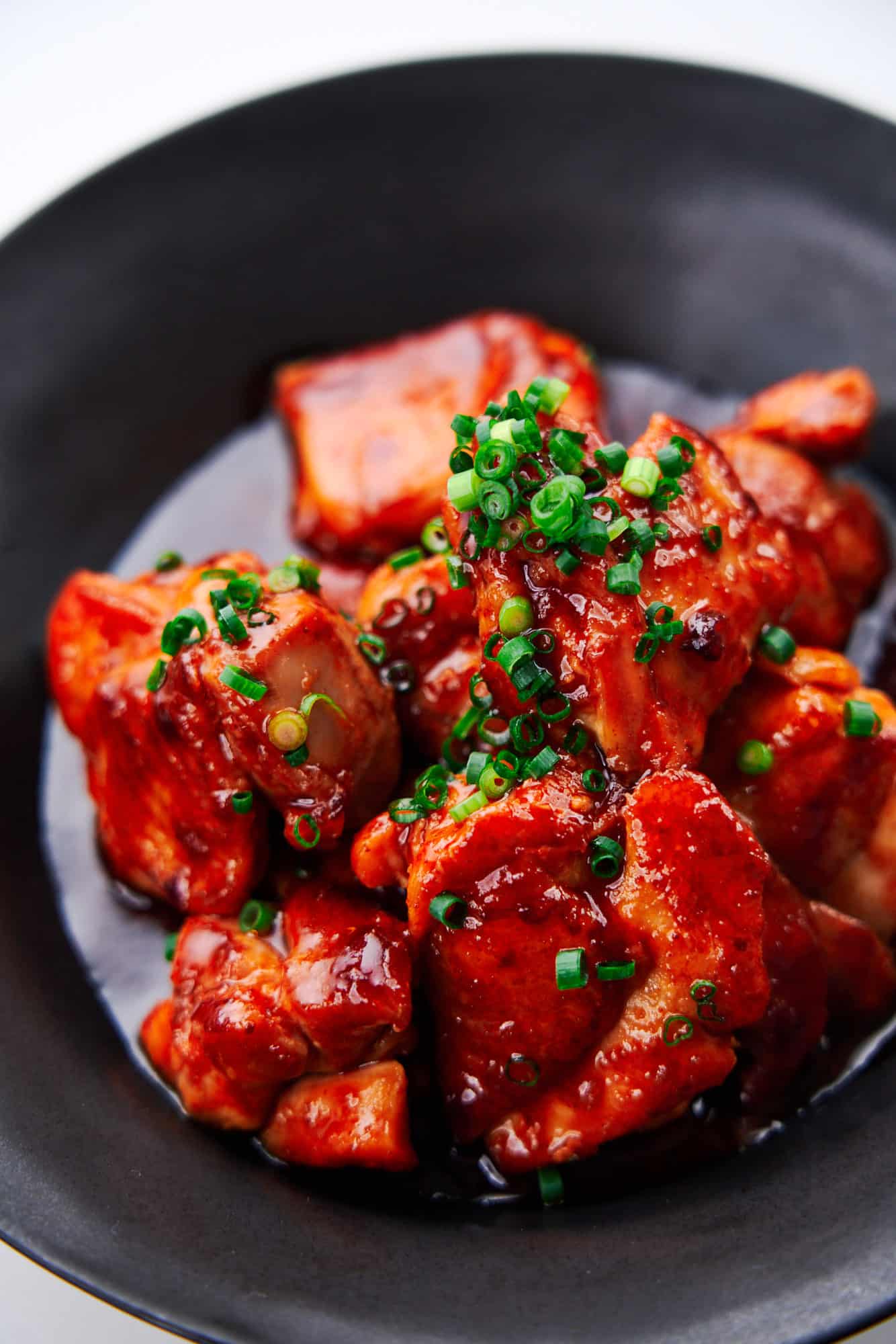 Juicy chunks of chicken thigh glazed in sweet and spicy gochujang sauce.