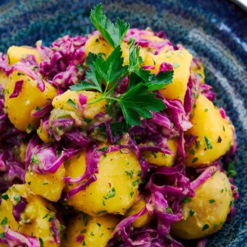 Quick pickled red cabbage and golden potato salad.