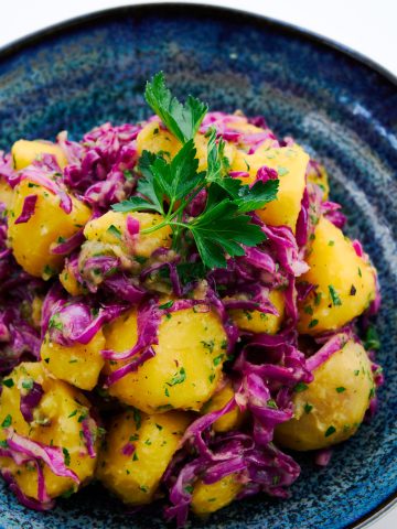 Quick pickled red cabbage and golden potato salad.
