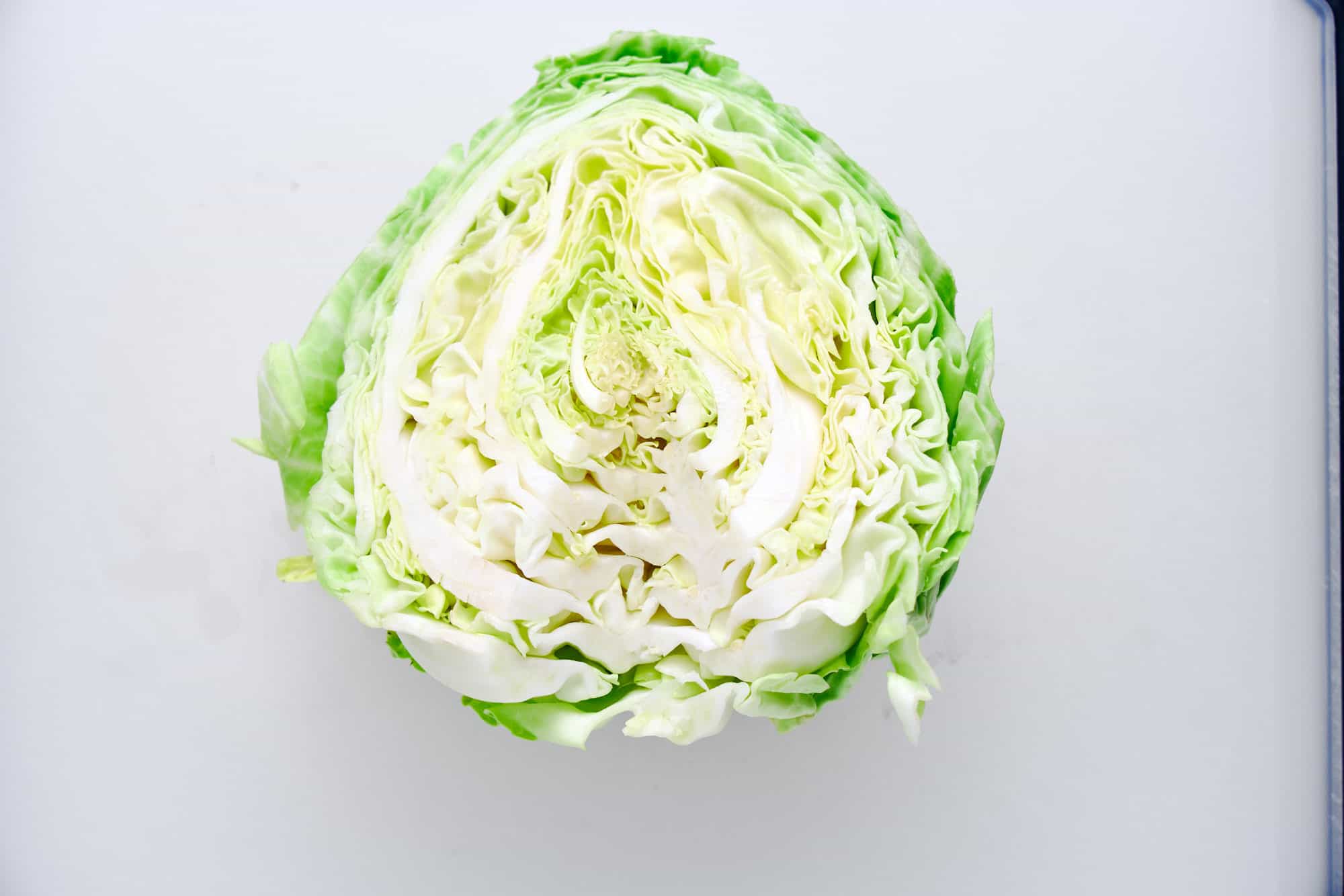 A head of spring cabbage with the core removed.