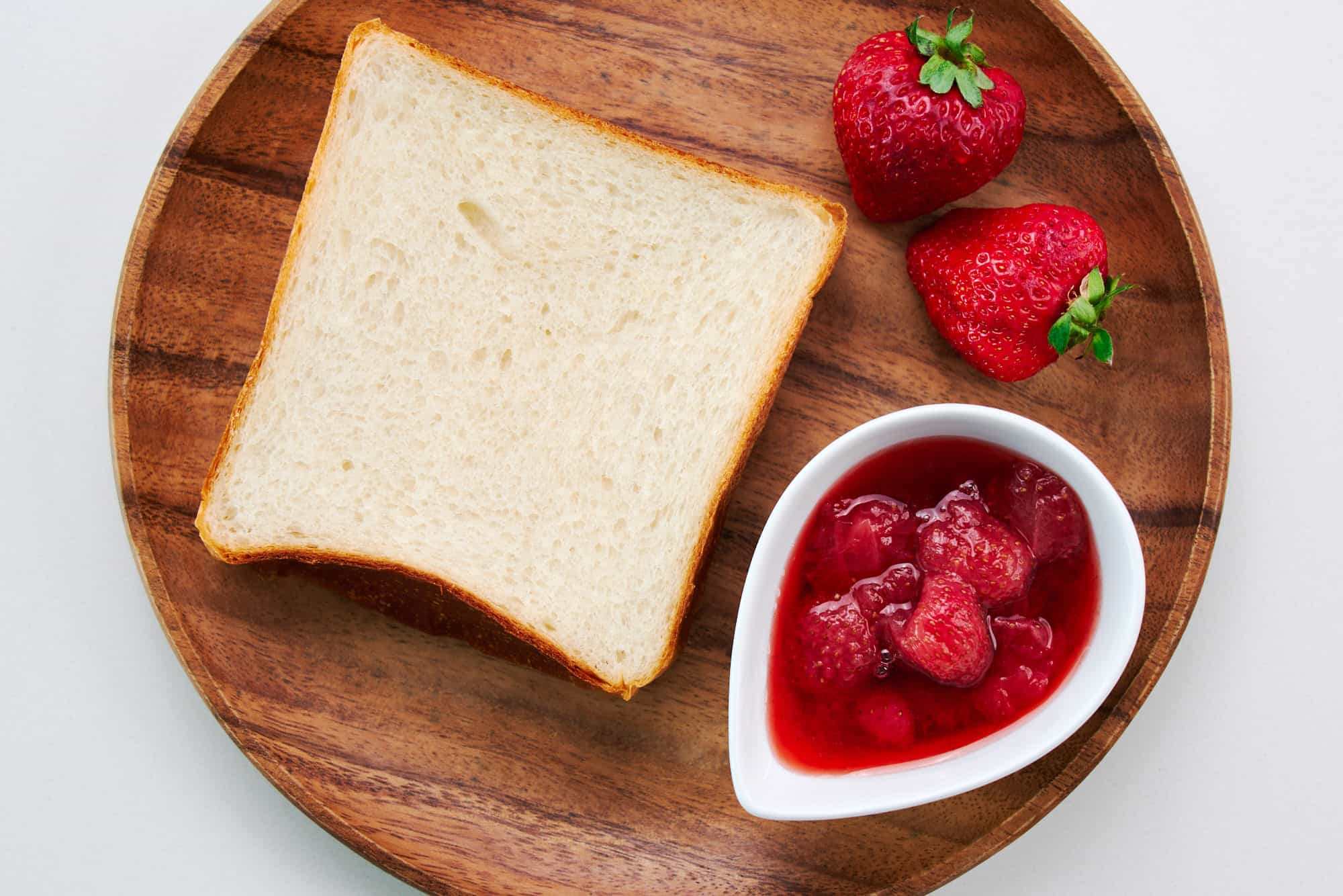 Bread, strawberries, and Strawberry Preserves.
