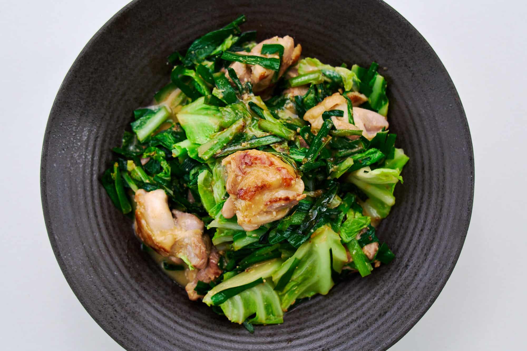 Easy miso butter chicken with a cabbage and garlic chive stir-fry.