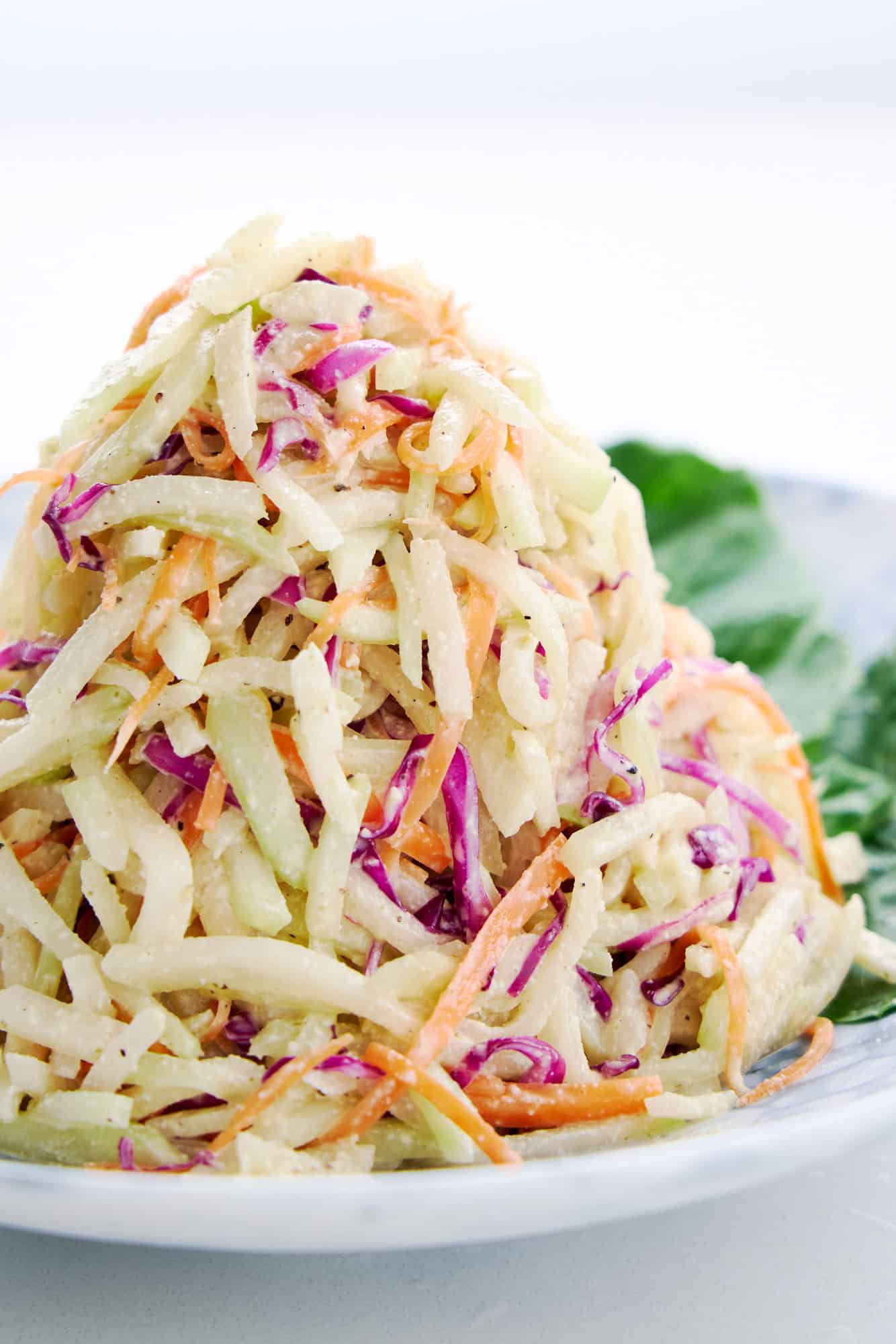 Crunchy mound of kohlrabi coleslaw with a tangy and creamy cashew nut dressing.