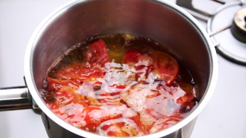 Tomatoes boiling in dashi.