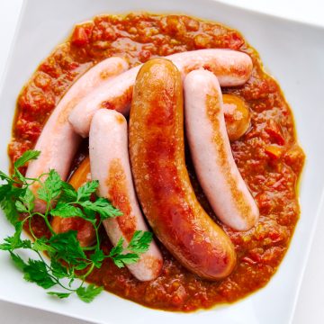 Sweet, savory, and spicy tomato curry sauce goes beautifully with pan-fried sausages.