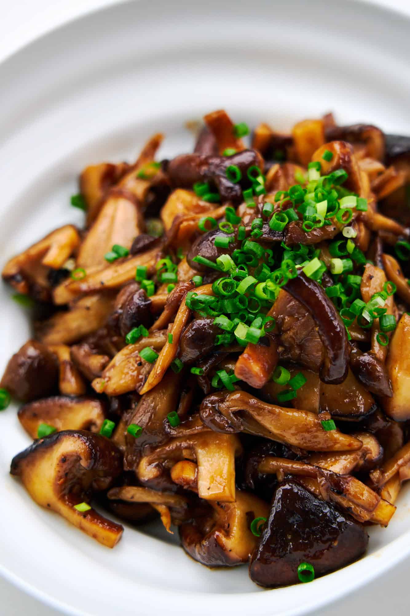 Medley of Japanese mushrooms, including shiitake, maitake, and shimeji glazed with honey garlic sauce.