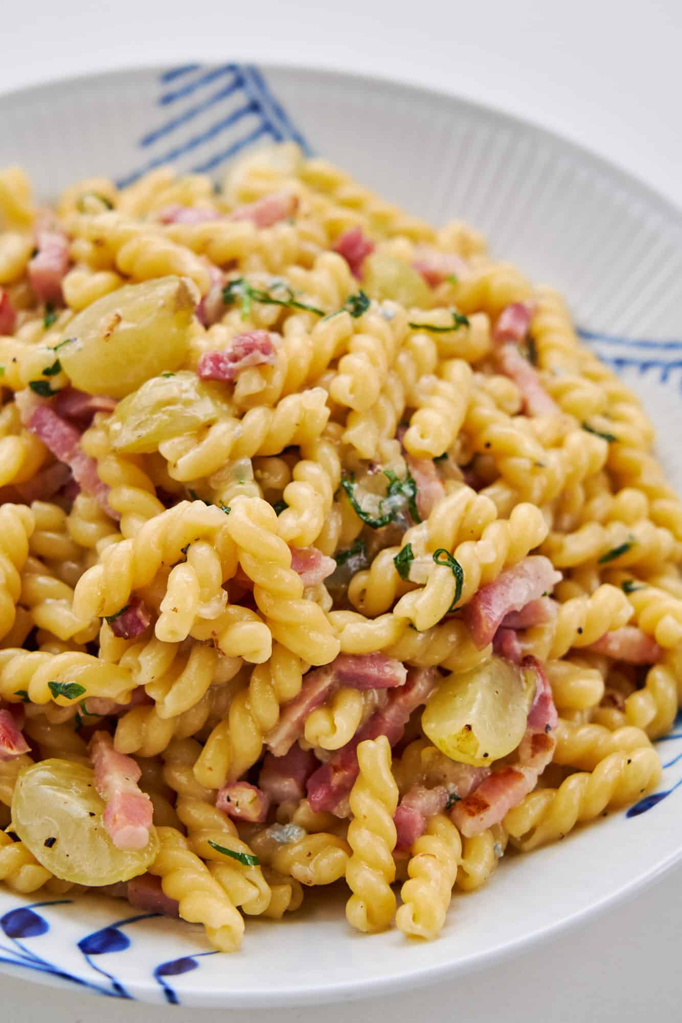 Gemelli tossed with pan roasted grapes and pancetta in gorgonzola cheese sauce.