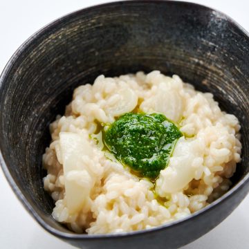 A bowl of Nanakusa Gayu, a traditional Japanese New Year porridge made with 7 herbs.