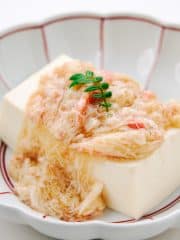 Tofu with crab sauce on a Japanese plate.