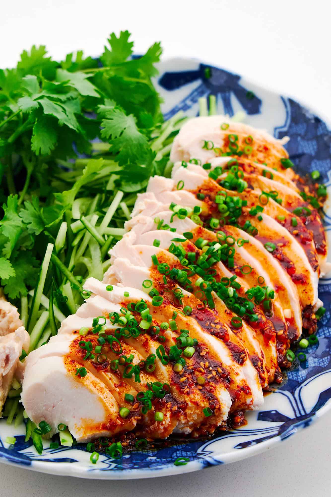 Poached chicken is delightful infused with ginger and topped with chili oil.