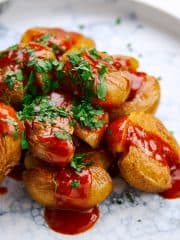 Crispy fried potatoes with a spicy sauce.