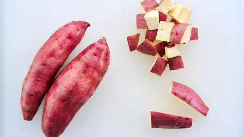 Cutting Japanese sweet potatoes.