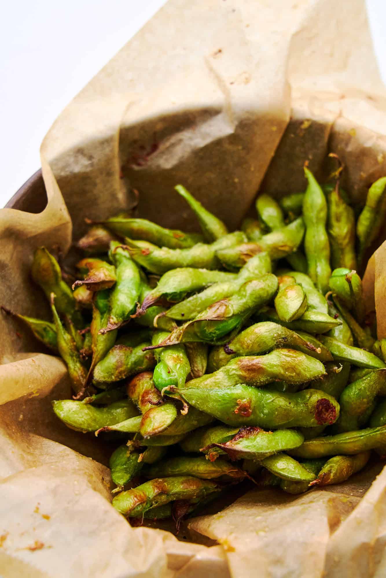 Edamame roasted on parchment paper.