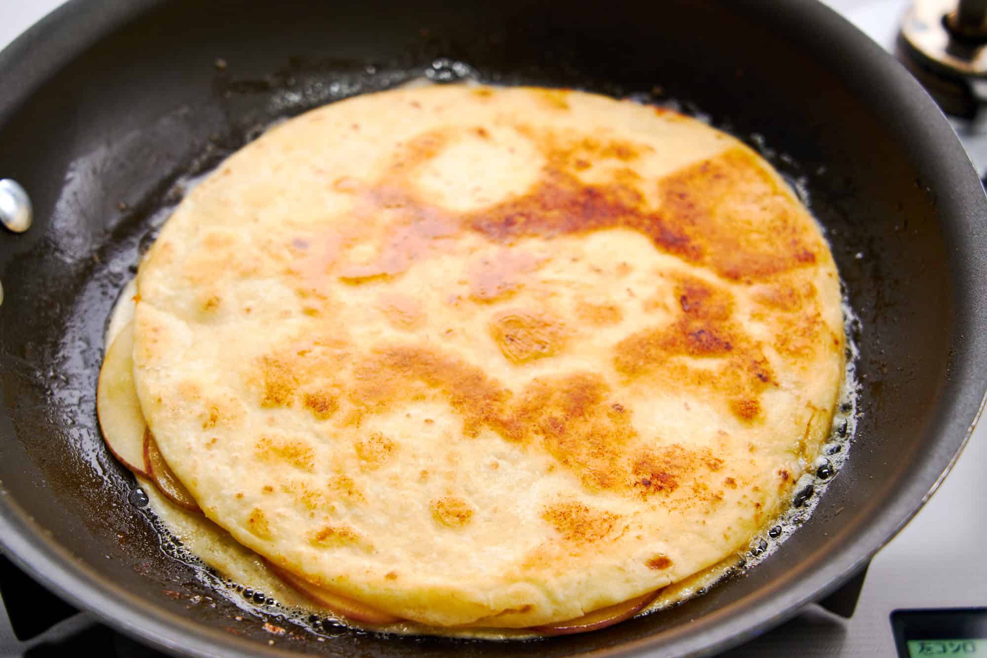 Frying the quesadilla.