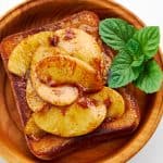 Delicious cinnamon toast gets a topping of sautéed apples.