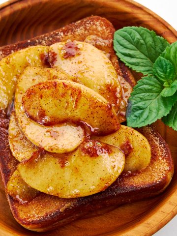 Delicious cinnamon toast gets a topping of sautéed apples.