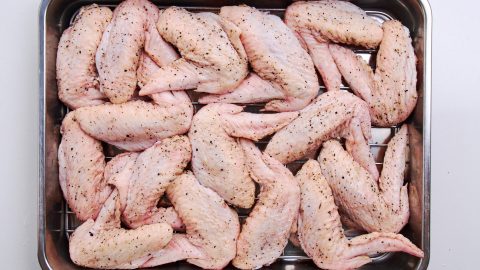 Wings get air-dried in the refrigerator overnight.