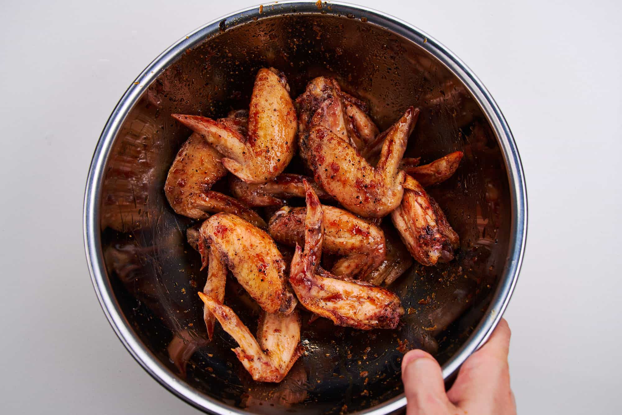 Wings are coated in Tebasaki sauce.