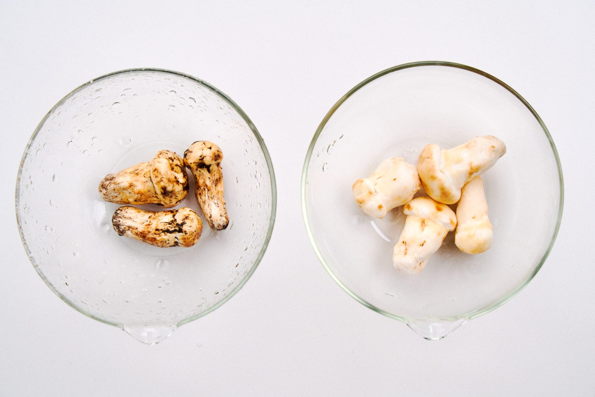 Dirty and cleaned Matsutake mushrooms.