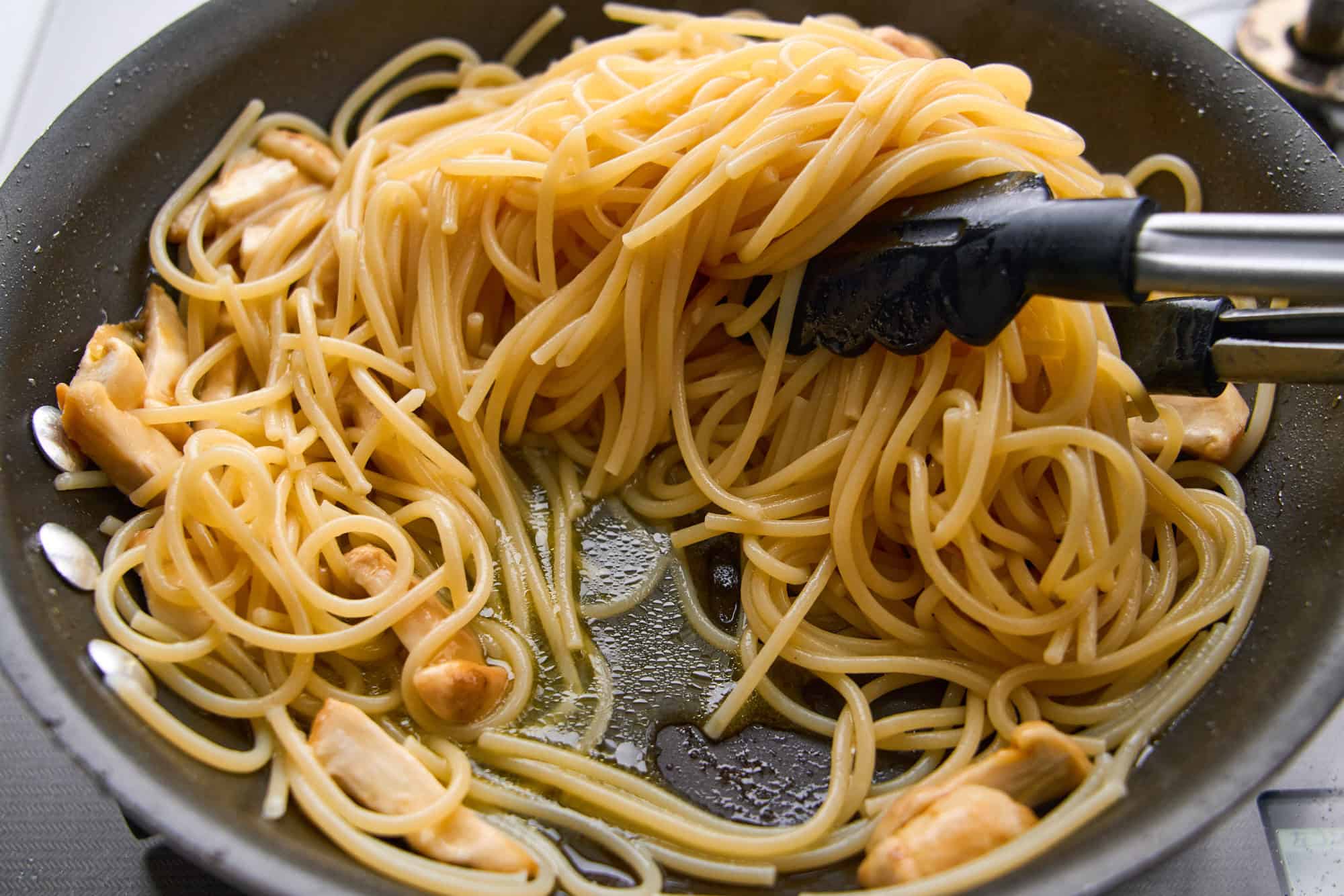 Pasta gets incorporated with the mushrooms.