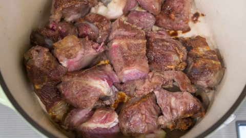 Beef cheeks in a pot.