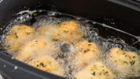 Chicken nuggets in the fryer.