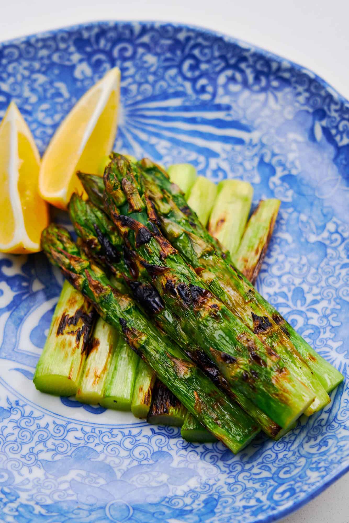 Asparagus on a blue plate.