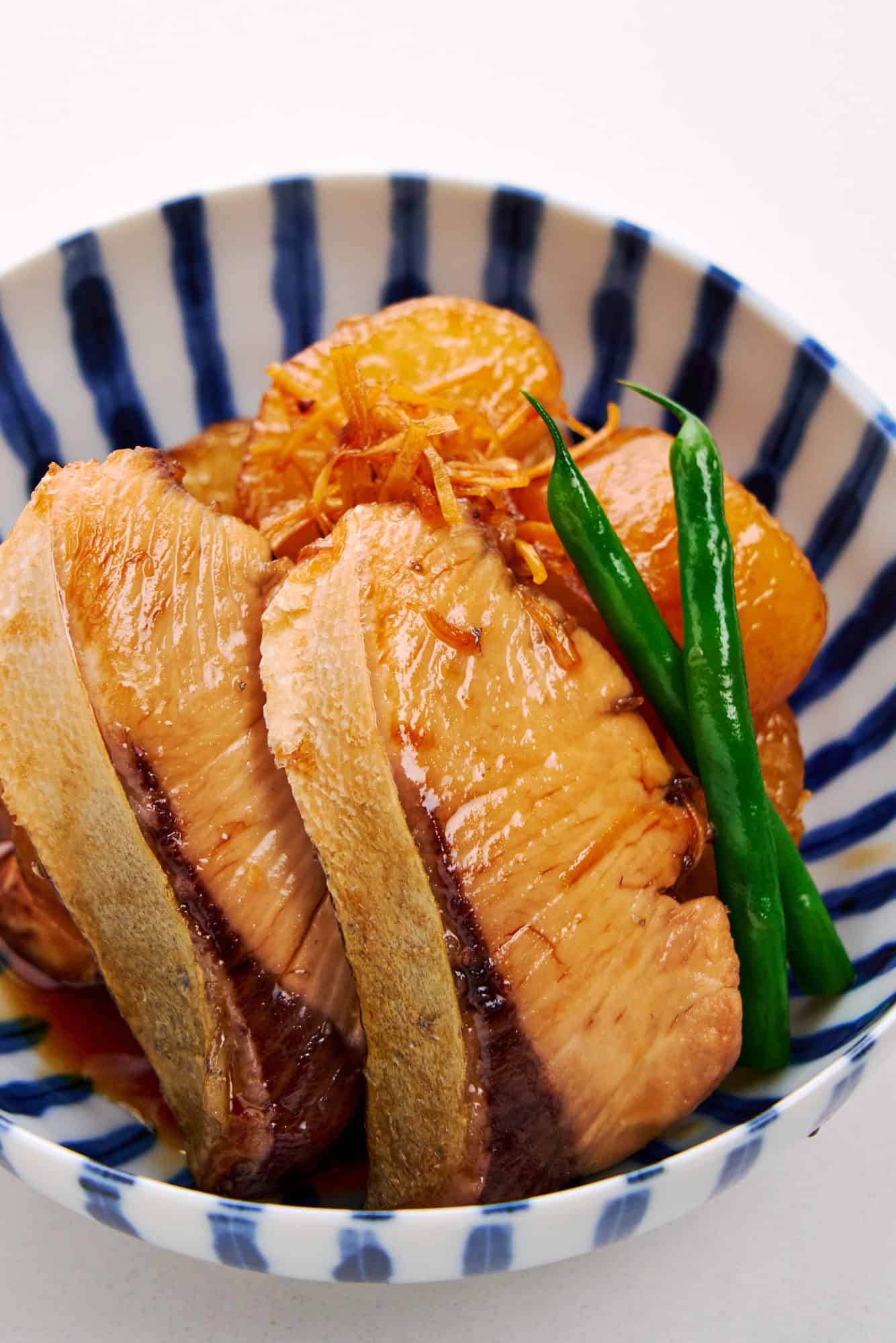 Closeup of tuna braised with daikon.