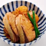 Buri Daikon garnished with green beans.