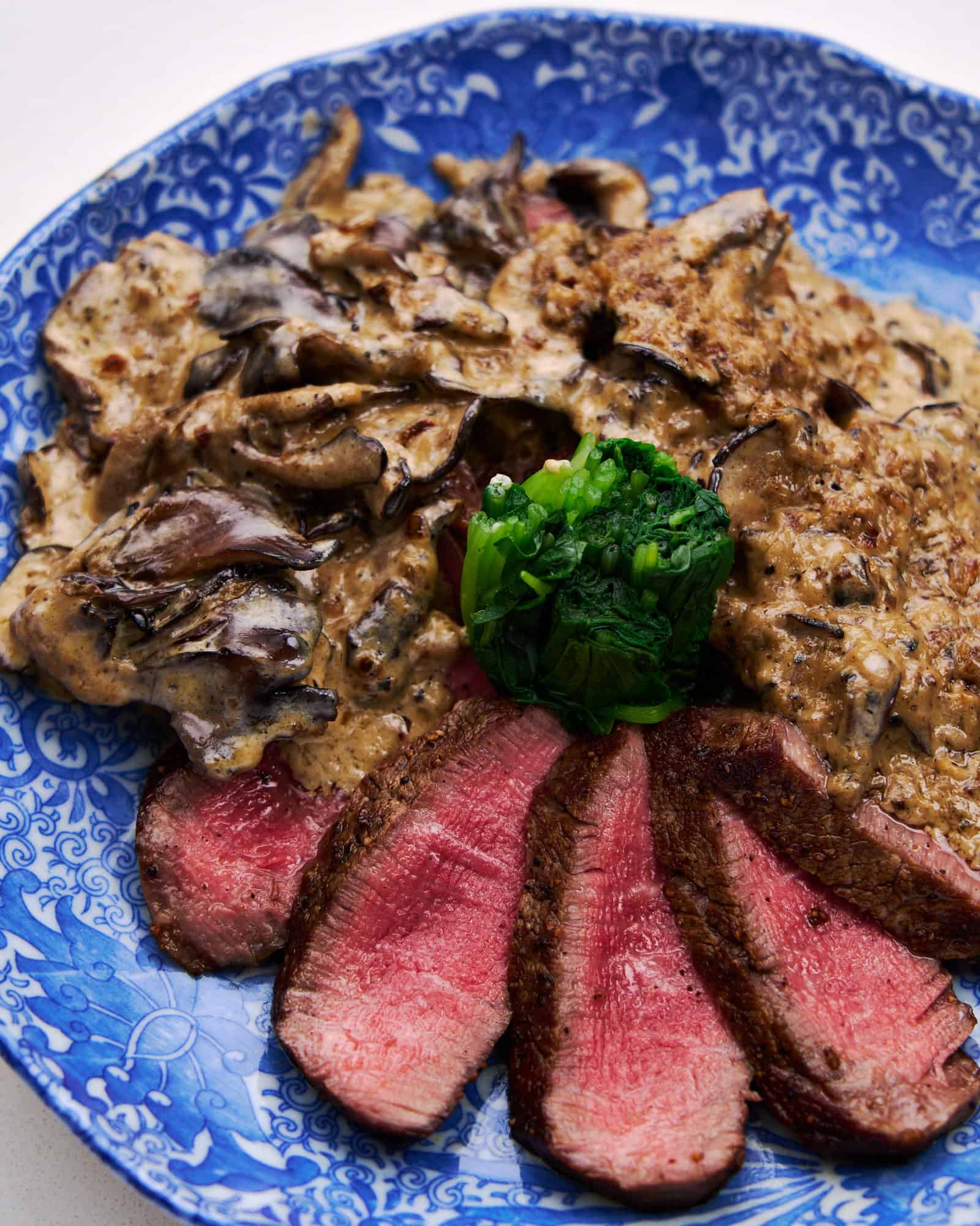 Tenderloin, seared to perfection, accompanied by a blanket of smooth, earthy, mushroom cream sauce.