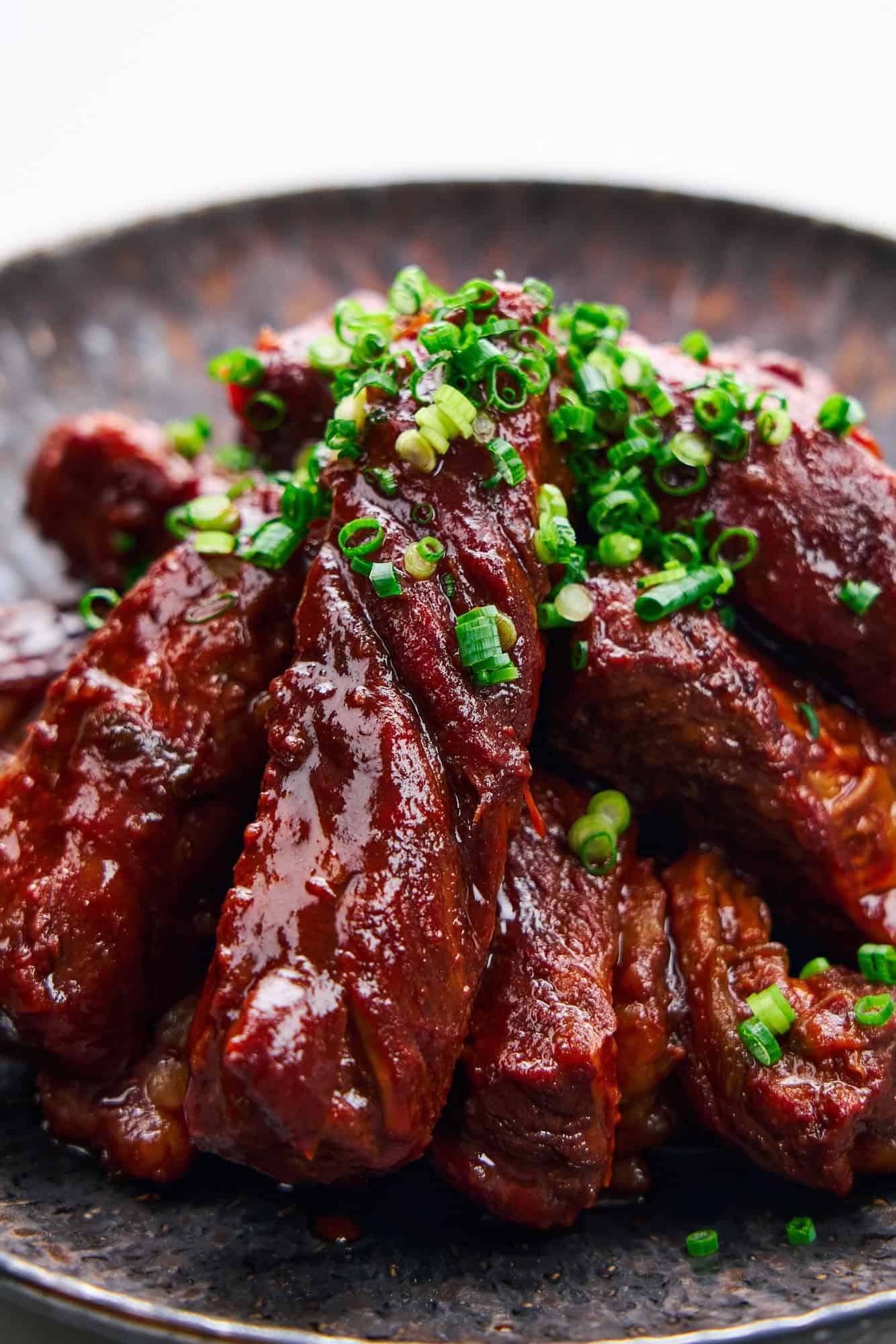 A delicious, shiny glaze adorns these beef rib fingers.