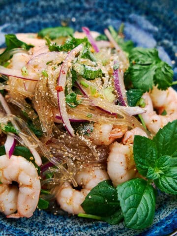 Slippery glass noodles, tender shrimp, bright herbs, and crunchy toasted rice powder make this salad a textural feast.