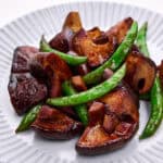 Soy sauce butter shiitakes and snap peas.