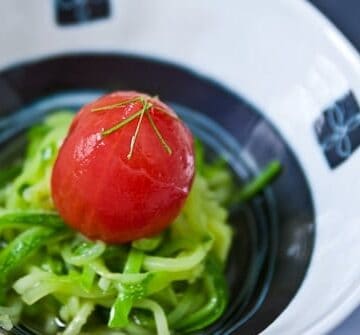 A refreshing summer salad of poached tomato and zucchini.