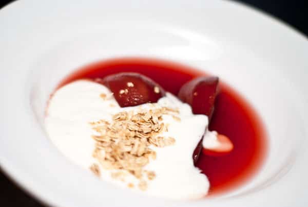 Pomegranate Poached Pears with yogurt and granola.