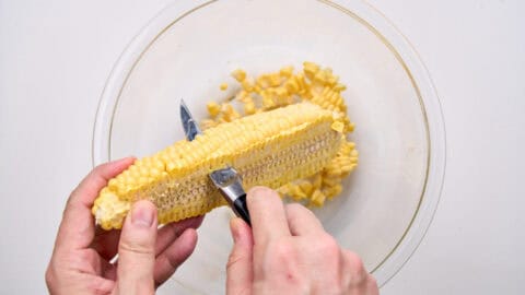 Cutting kernels off for corn tempura.