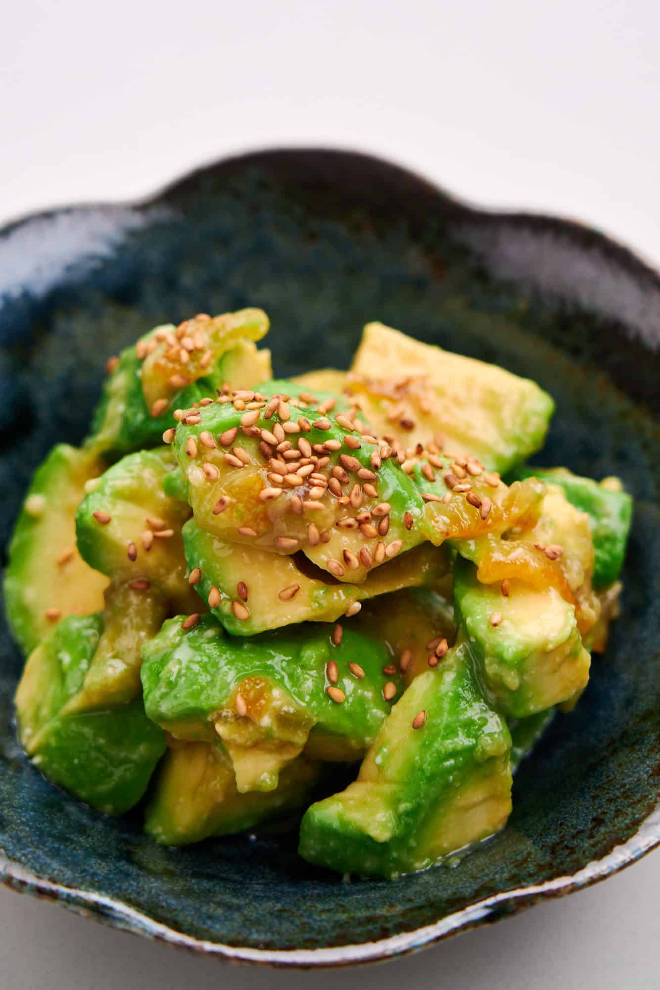 Detail image of avocado yuzu miso with sesame seeds.