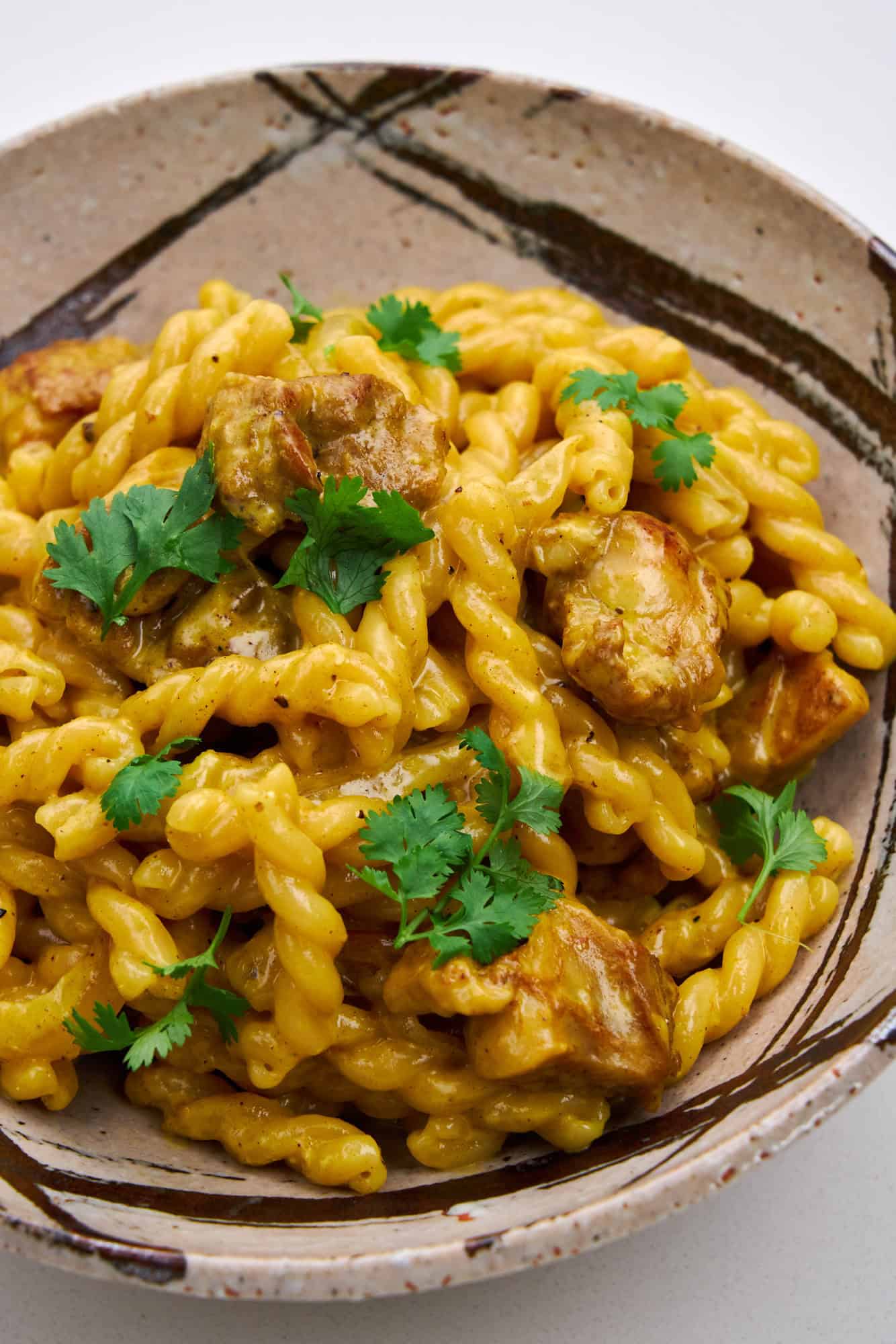 Spicy sauce enrobes tender chicken and al dente pasta.