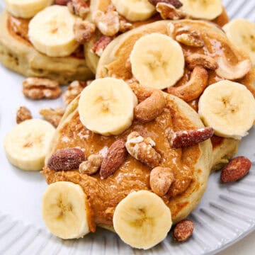 Fluffy Buckwheat Pancakes served with bananas and nuts.