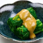 Nanohana dressed with a tangy sauce.