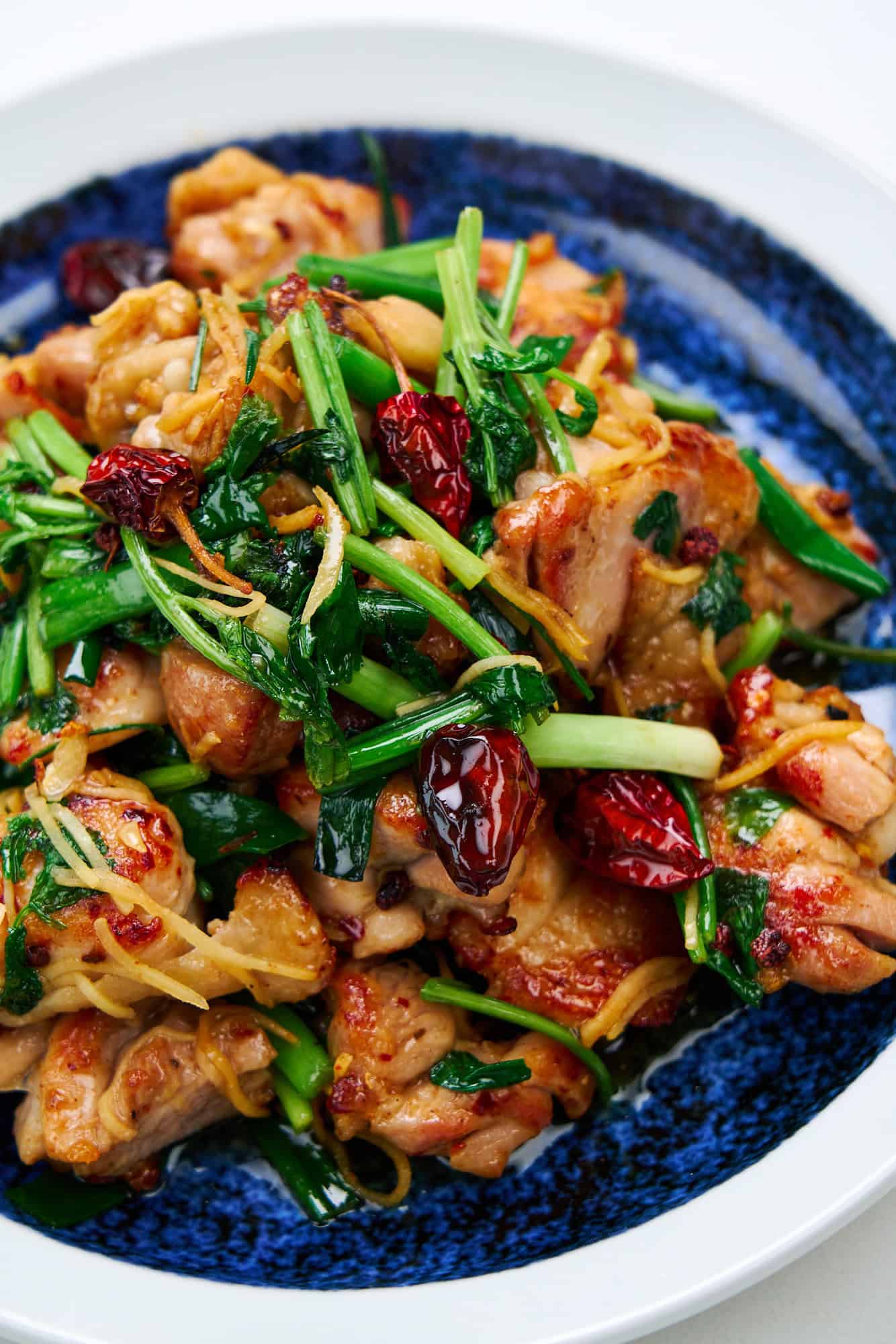 Spicy and flavorful Firecracker Chicken in a blue and white bowl.