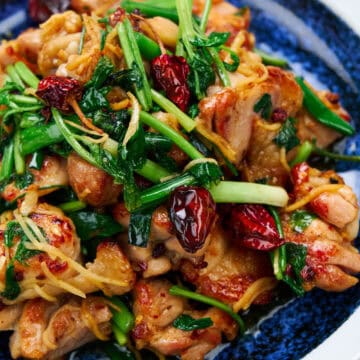 Firecracker chicken with wilted greens and dried chilies.