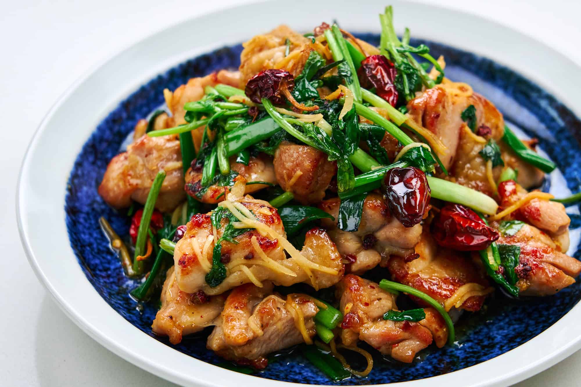 Spicy and flavorful Firecracker Chicken in a blue and white bowl.